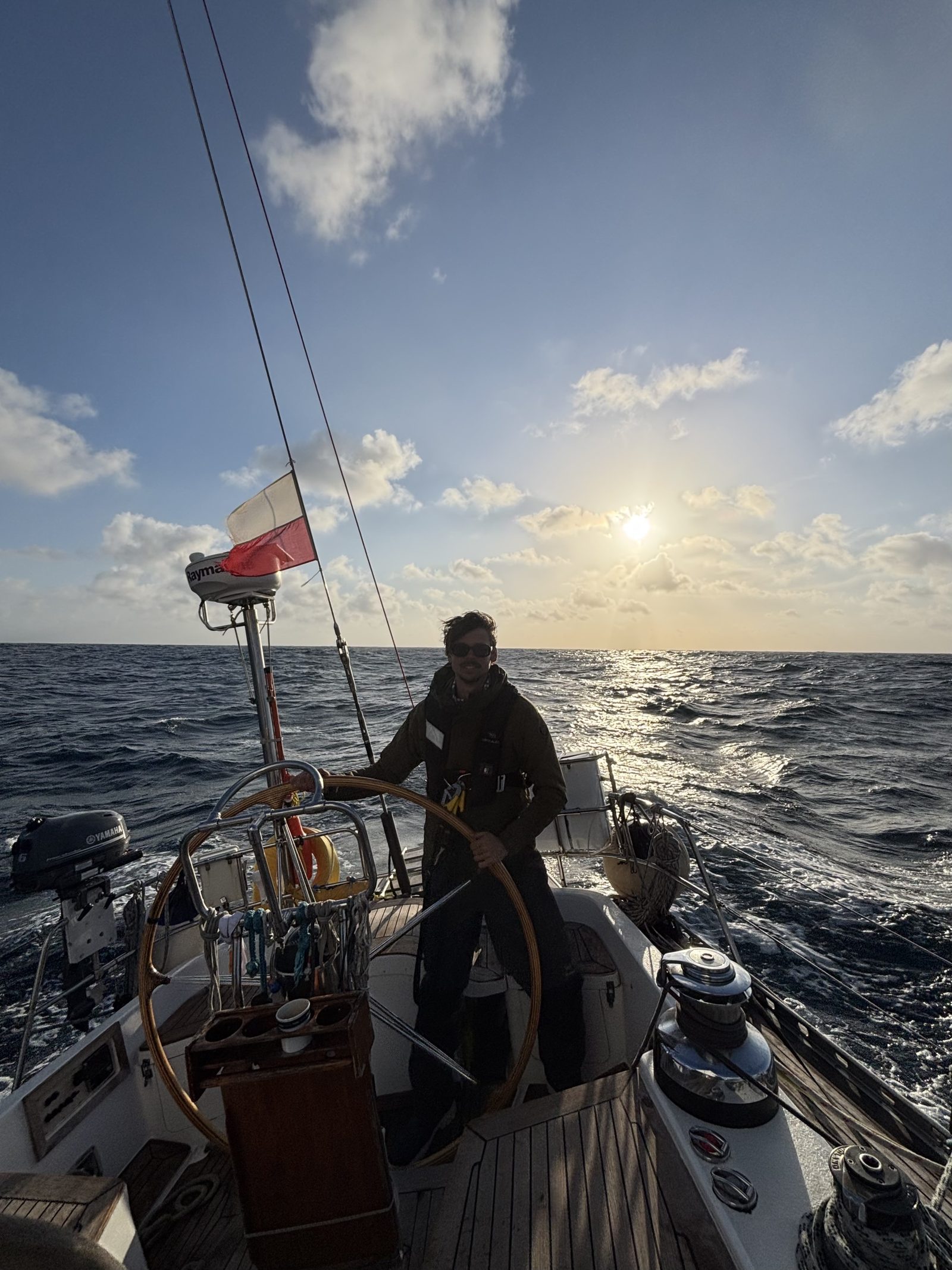 Thijs sailing on a friend's boat during an Atlantic crossing