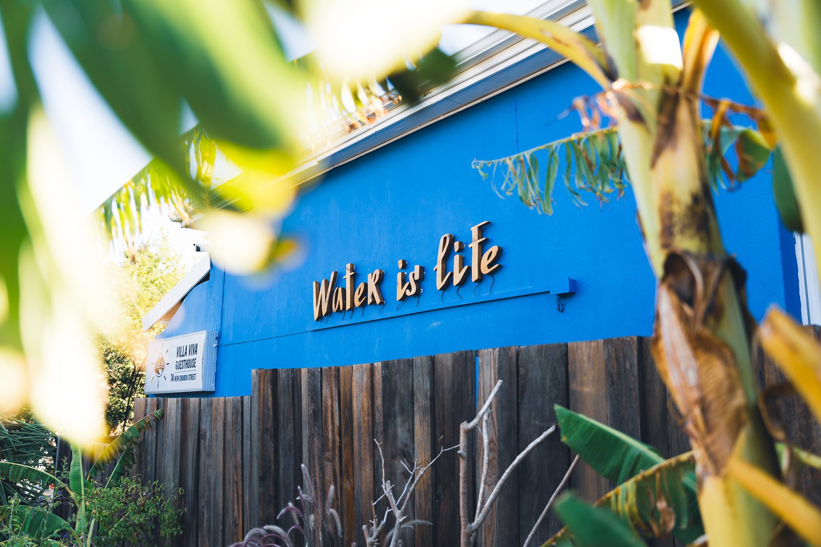 The Villa Viva guesthouse facade with the words 'Water is life'