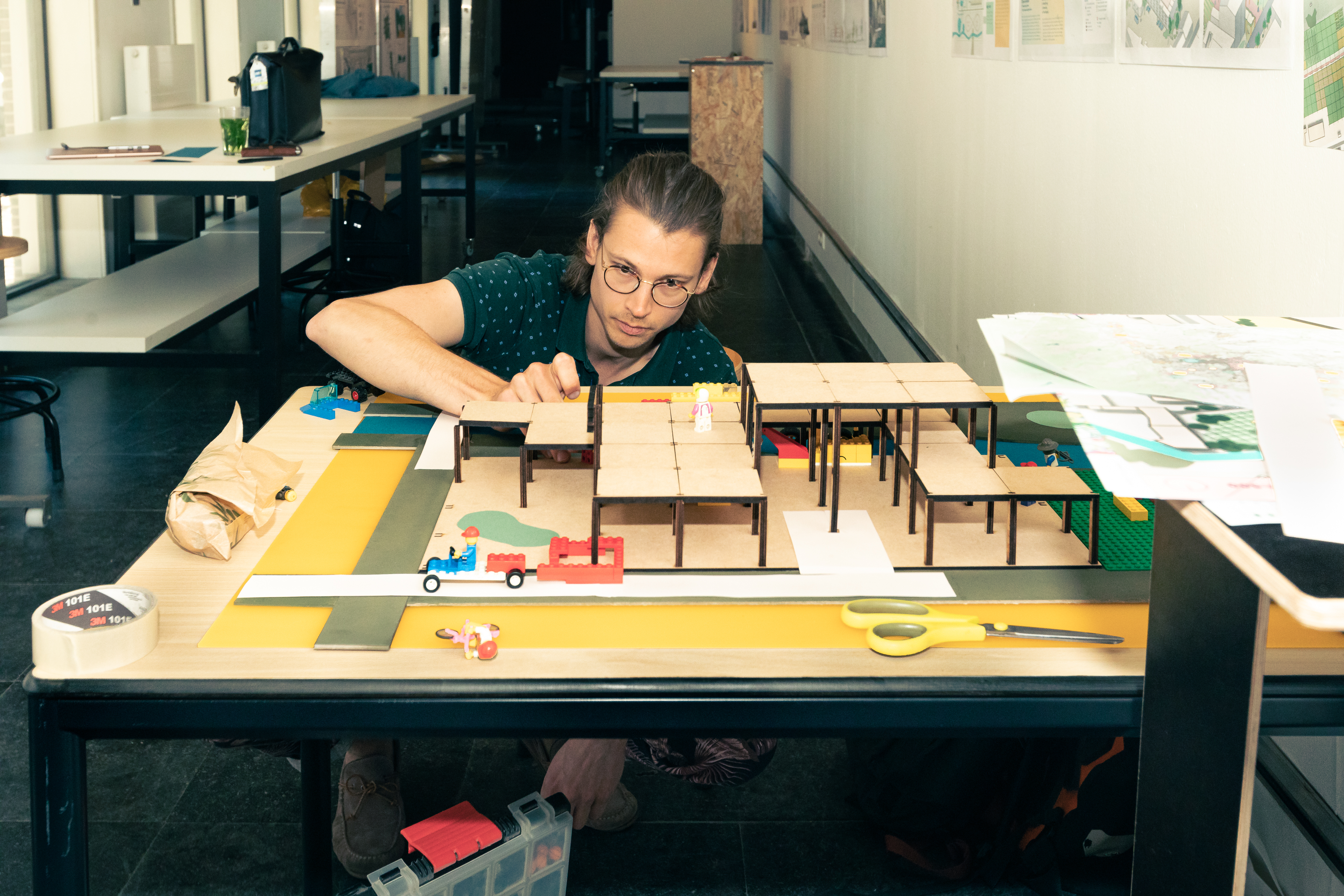 Thijs building a colourful modular city model
